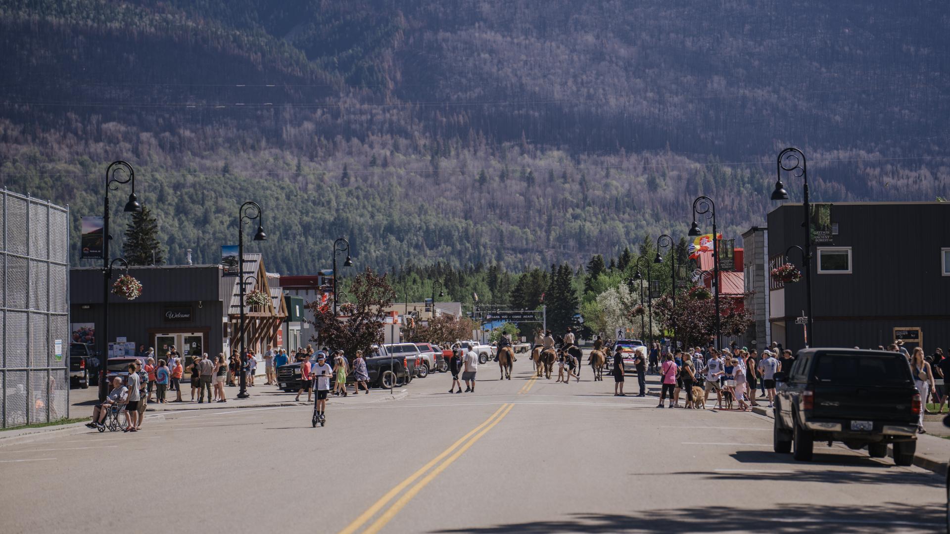 group of people on a street in sunshine