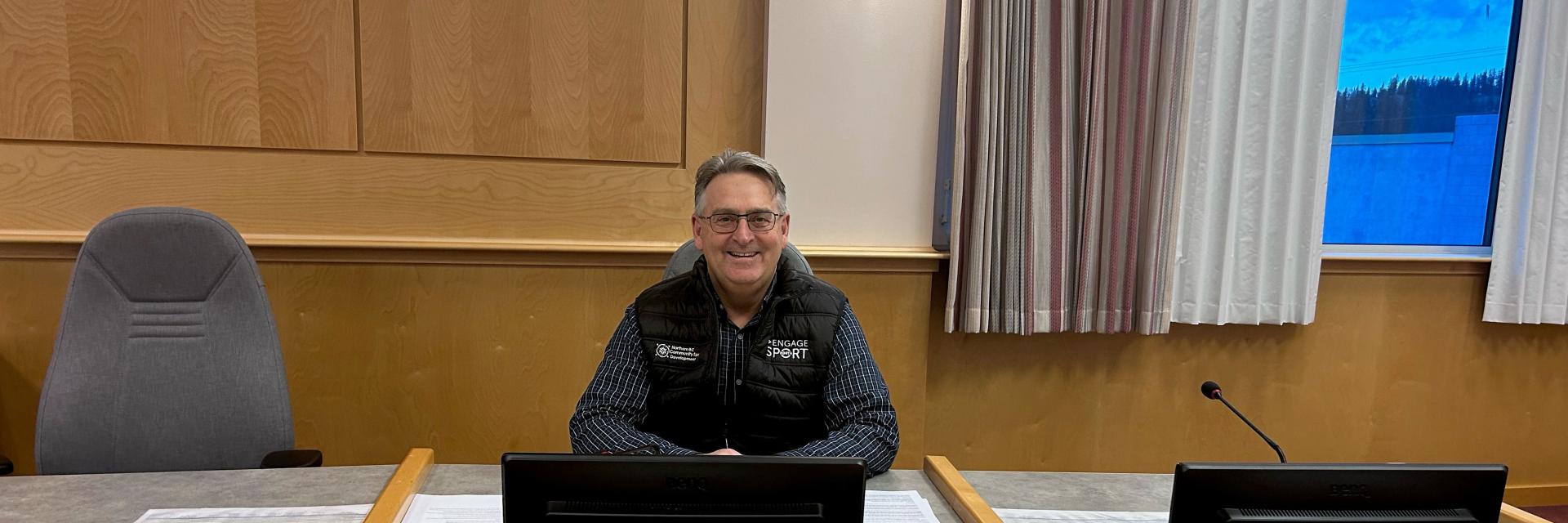man sitting at a desk
