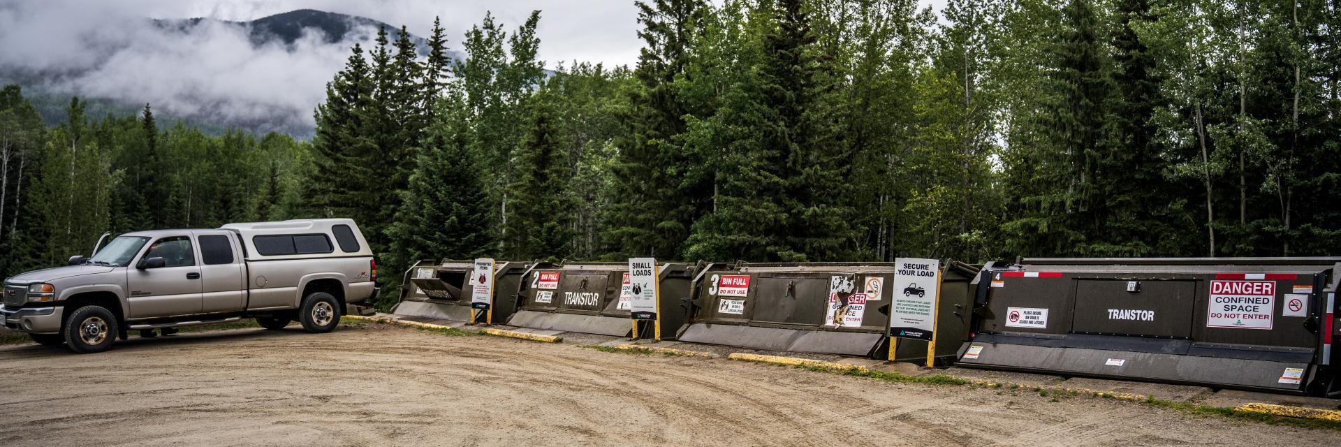 truck parked at garbage bins